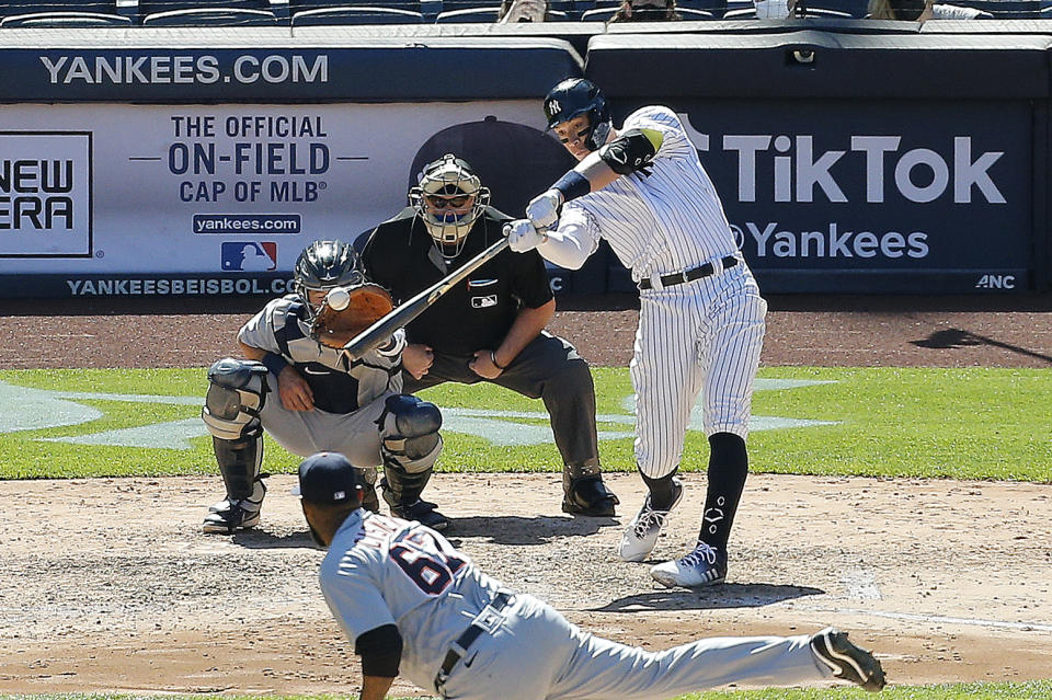 May 1, 2021; Bronx, New York, USA; New York Yankees designated hitter Aaron Judge (99) hits two run single against the Detroit Tigers during the sixth inning at Yankee Stadium. Mandatory Credit: Andy Marlin-USA TODAY Sports