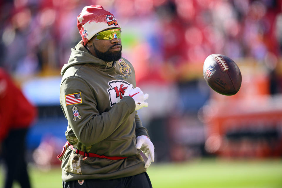 FILE - Kansas City Chiefs running back Clyde Edwards-Helaire wears a Salute to Service hoodie during warmups before an NFL football game against the Jacksonville Jaguars, Sunday, Nov. 13, 2022 in Kansas City, Mo. The Chiefs are re-signing Jerick McKinnon and declined the fifth-year option on fellow running back Clyde Edwards-Helaire on Tuesday, May 2, 2023, solidifying their backfield behind incumbent Isiah Pacheco heading into offseason workouts. (AP Photo/Reed Hoffmann, File)