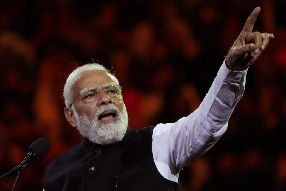 Indian Prime Minister Narendra Modi gestures as he delivers his speech during an Indian community event at Qudos Bank Arena in Sydney, Australia, Tuesday, May 23, 2023. Modi has arrived in Sydney for his second Australian visit as India's prime minister and told local media he wants closer bilateral defense and security ties as China's influence in the Indo-Pacific region grows. (AP Photo/Mark Baker)