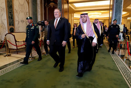 FILE PHOTO: U.S. Secretary of State Mike Pompeo walks with Saudi Foreign Minister Adel al-Jubeir in Riyadh, Saudi Arabia, October 16, 2018. REUTERS/Leah Millis/Pool/File Photo