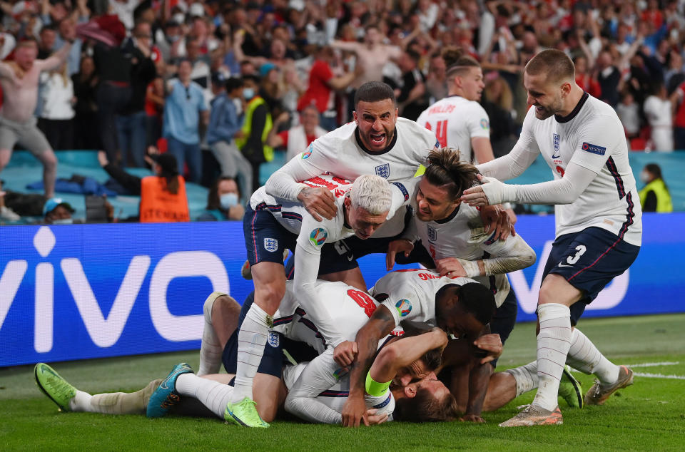 LONDON, ENGLAND - JULY 07: Harry Kane of England is congratulated after scoring his team's second goal by Jordan Henderson, Phil Foden, Kyle Walker, Jack Grealish, Raheem Sterling and Luke Shaw during the UEFA Euro 2020 Championship Semi-final match between England and Denmark at Wembley Stadium on July 07, 2021 in London, England. (Photo by Laurence Griffiths/Getty Images)