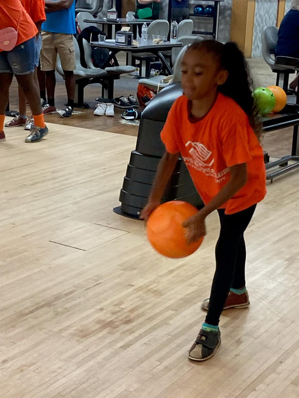 Mia Marmolejos bowls for the first time during Saturday's Florida Sports Hall of Fame event at Greenacres Bowl.