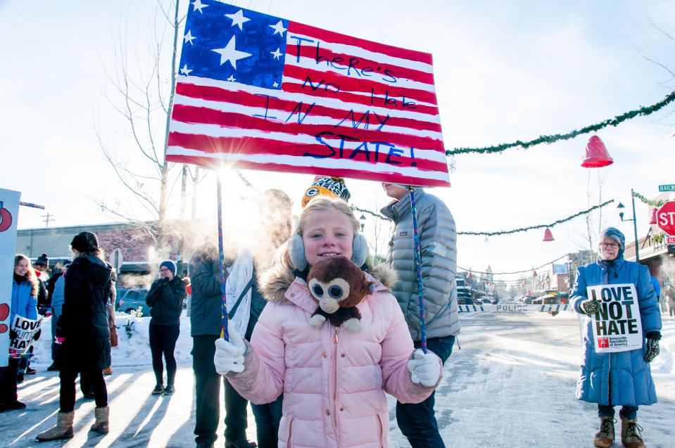 Hazel Ryan, 8, who travelled from Butte, MT, holding a sign that she made for the event. (Photo: Lauren Grabelle)