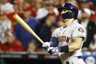 Houston Astros' Carlos Correa watches his two-run home run against the Washington Nationals during the fourth inning of Game 5 of the baseball World Series Sunday, Oct. 27, 2019, in Washington. (AP Photo/Patrick Semansky)