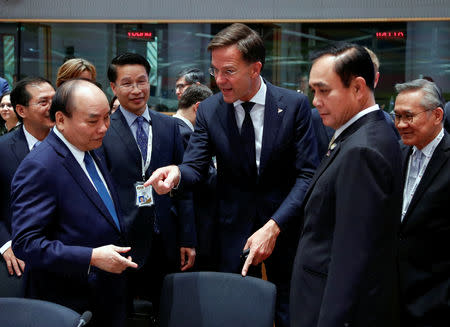 Vietnam's Prime Minister Nguyen Xuan Phuc, Prime Minister of Thailand Prayut Chan-o-cha and Dutch Prime Minister Mark Rutte attend the ASEM leaders summit in Brussels, Belgium October 19, 2018. REUTERS/Francois Lenoir