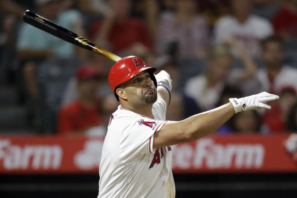 Los Angeles Angels' Albert Pujols watches his three-run home run against the Boston Red Sox during the eighth inning of a baseball game in Anaheim, Calif., Saturday, Aug. 31, 2019. (AP Photo/Chris Carlson)