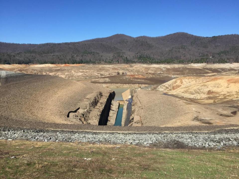 This 2017 photo shows the upper reservoir of Duke Energy's Bad Creek pumped storage facility as it drains.  When the reservoir is full, Duke pushes water in and out of the facility to store and generate electricity.