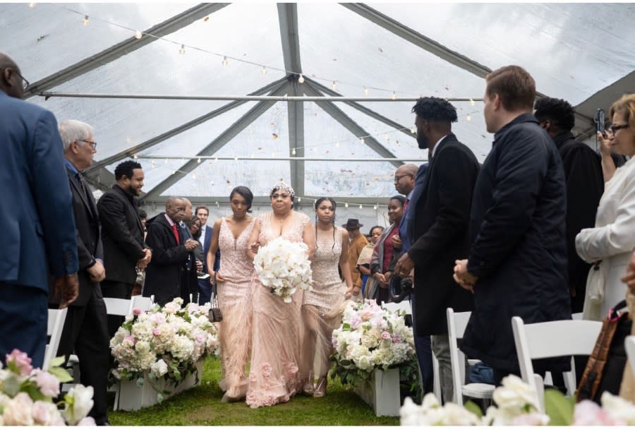 April Ryan, accompanied by her daughters Ryan and Grace, walks down the aisle at her wedding to James Ewing on Oct. 14. (Photo: Clapp Studios Photography)