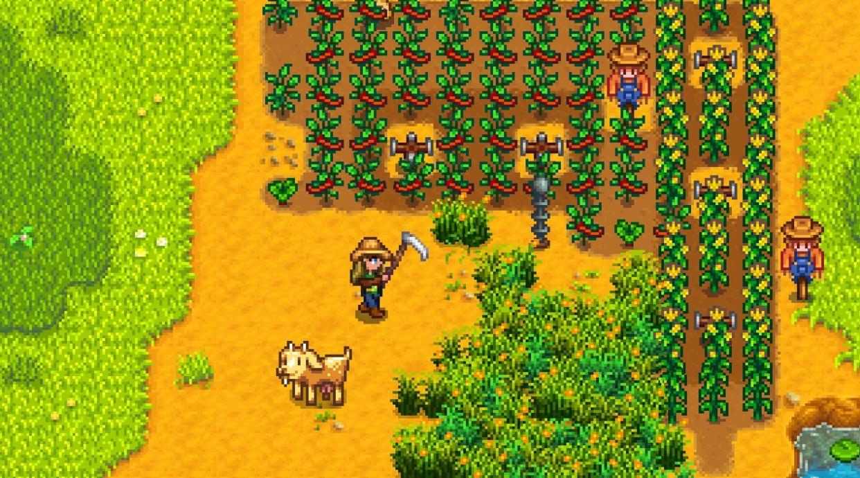  Stardew Valley - a player swings a scythe at a patch of grass near a field of peppers and a goat. 