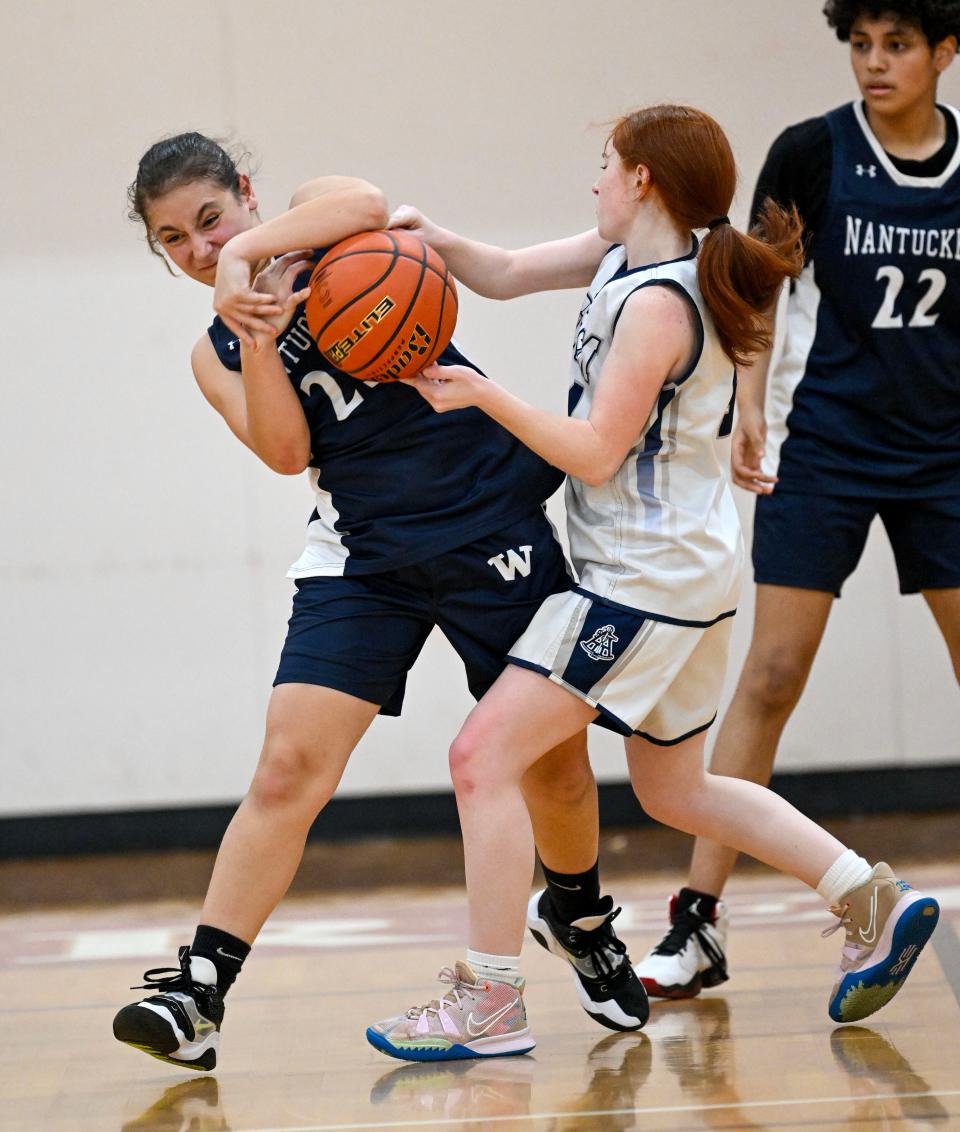 HYANNIS  02/02/24 Alana Ludvingson of Nantucket and Victoria Sassone of Sturgis East tangle. Girls basketball
Ron Schloerb/Cape Cod Times