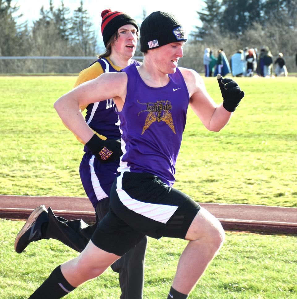 Holland Patent Golden Knight Andrew Kanclerz passes Little Falls Mountie Jonathan Reese (left) for the lead on the final straightaway of the 800-meter run Wednesday.