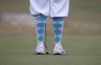 Rickey Fowler of the U.S. sports traditional "Plus Fours" while waiting to putt on the 12th green during the first round of the U.S. Open Championship golf tournament in Pinehurst, North Carolina, June 12, 2014. REUTERS/Mike Segar