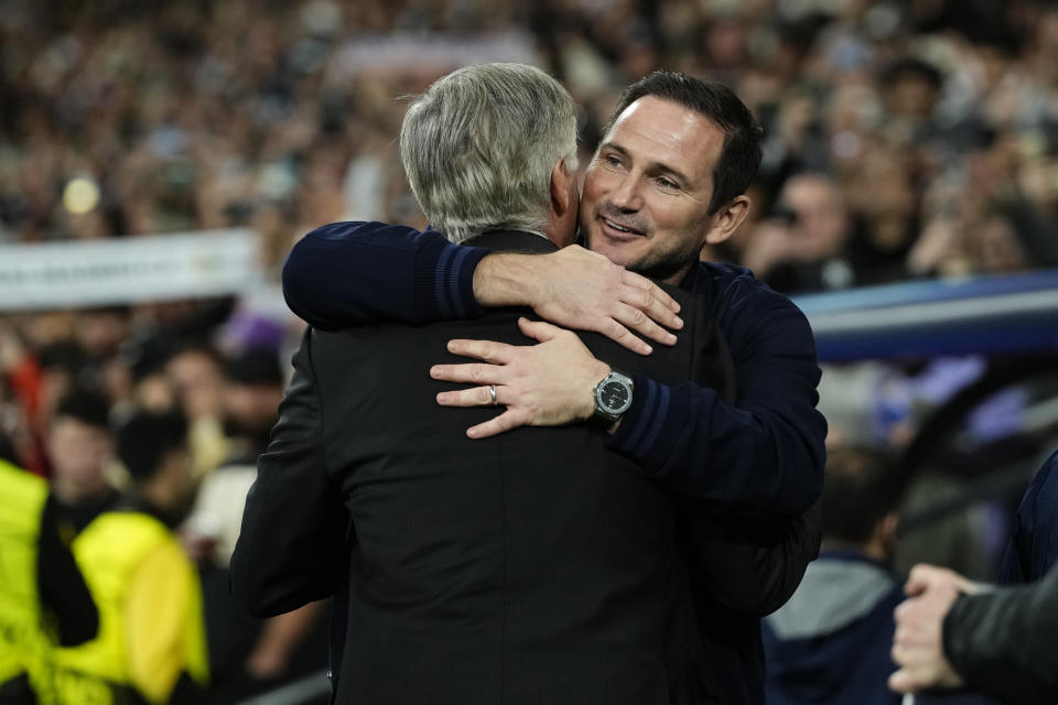 Chelsea's caretaker coach Frank Lampard, right, greets Real Madrid's head coach Carlo Ancelotti prior the Champions League quarter final first leg soccer match between Real Madrid and Chelsea at Santiago Bernabeu stadium in Madrid, Wednesday, April 12, 2023. (AP Photo/Jose Breton)