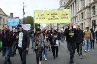 The protesters held signs as they marched in London (Picture: Getty)