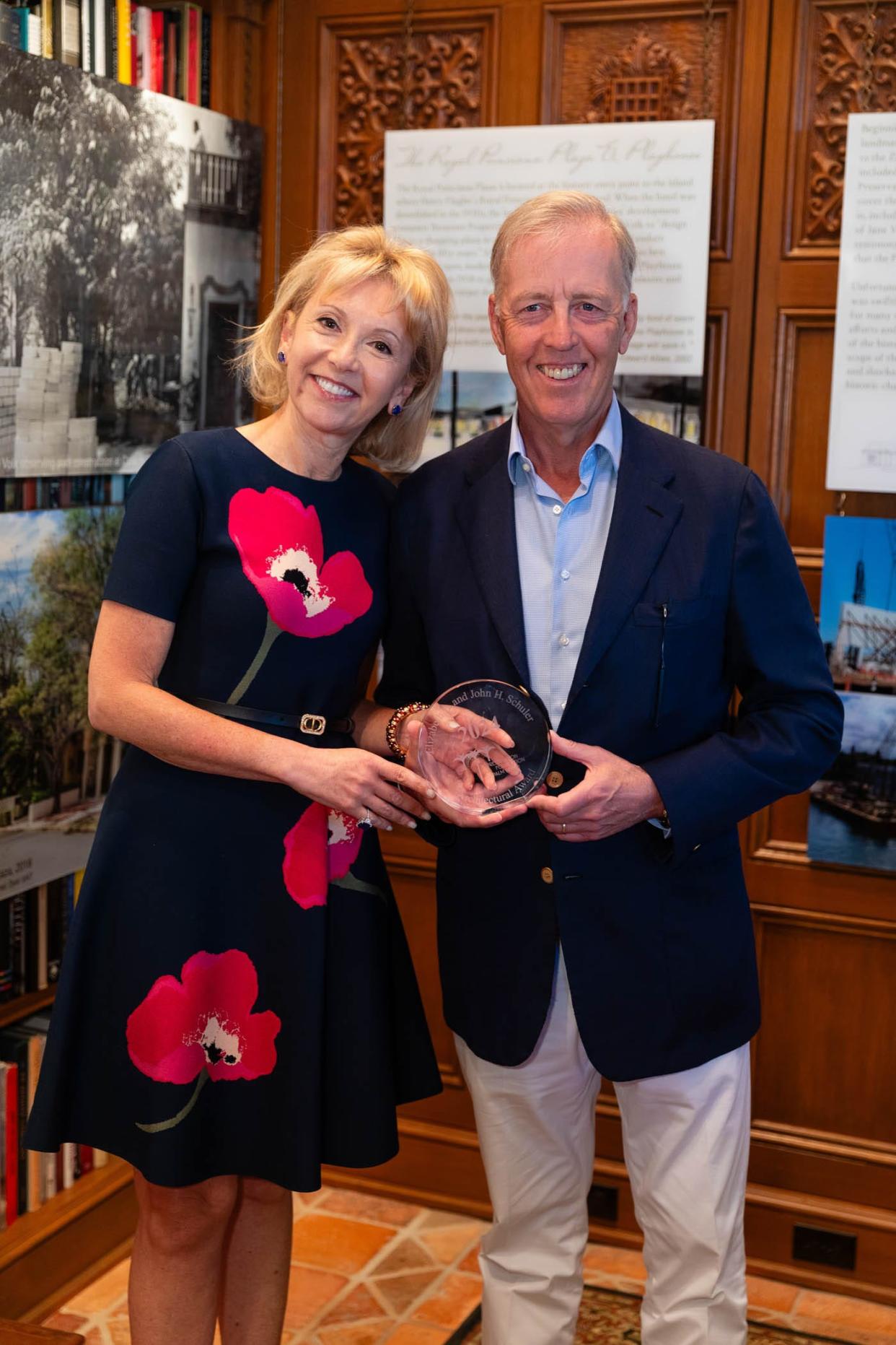 After an award ceremony at the Preservation Foundation of Palm Beach, Irina Liner and Marcel van Poecke hold a 2024 Schuler Award recognizing them for the custom home they built at 726 Hi Mount Road in Palm Beach.