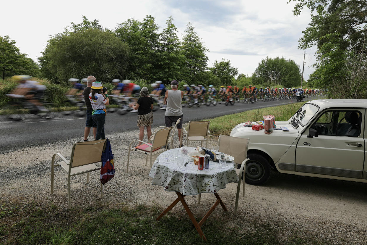 Spectators cheer on the peloton during Stage 10 of the Tour de France. (Thomas Samson/AFP via Getty Images)