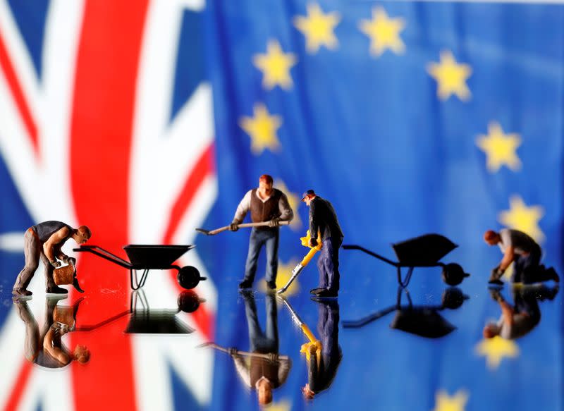 Small toy figures are seen in front of UK and European Union displayed flags in this illustration picture,