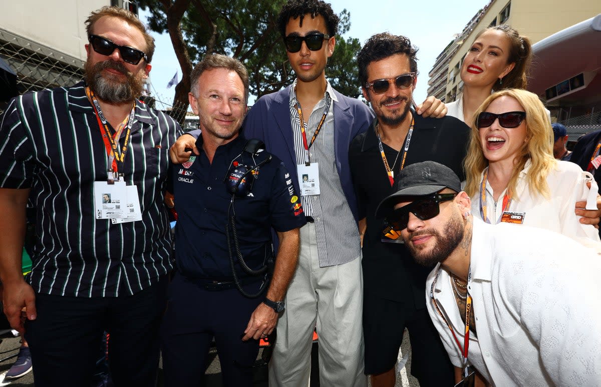 (L-R) David Harbour, Red Bull Racing Team Principal Christian Horner, Archie Madekwe, Orlando Bloom, Neymar, Maria Sharapova and Kylie Minogue pose for a photo on the grid during the F1 Grand Prix of Monaco at Circuit de Monaco on May 28, 2023 (Getty Images)