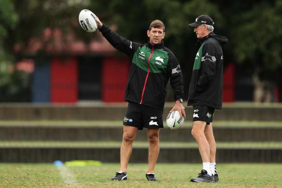 Pictured left to right, Jason Demetriou talking to Wayne Bennett during their time together as NRL coaches at South Sydney. 