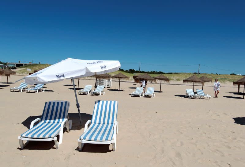 FILE PHOTO: A beach goer arrives at Jose Ignacio beach in the luxurious sea side resort of Punta del Este