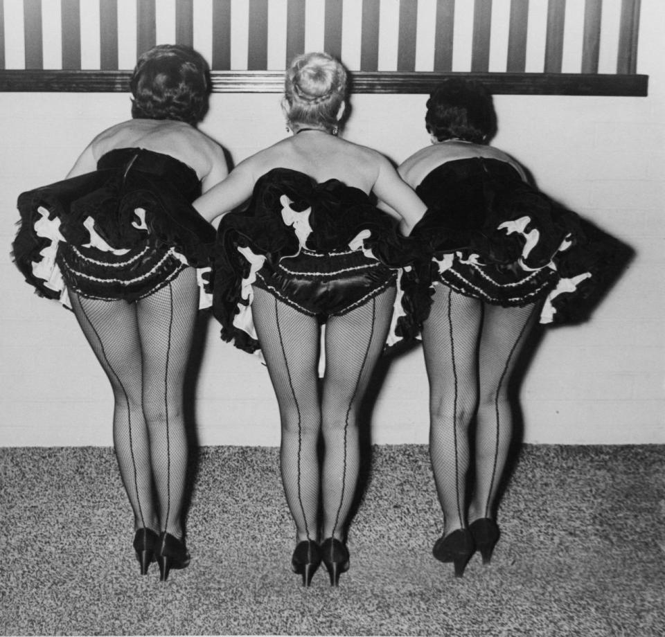 Cocktail waitresses at the club Black Magic circa 1950.
