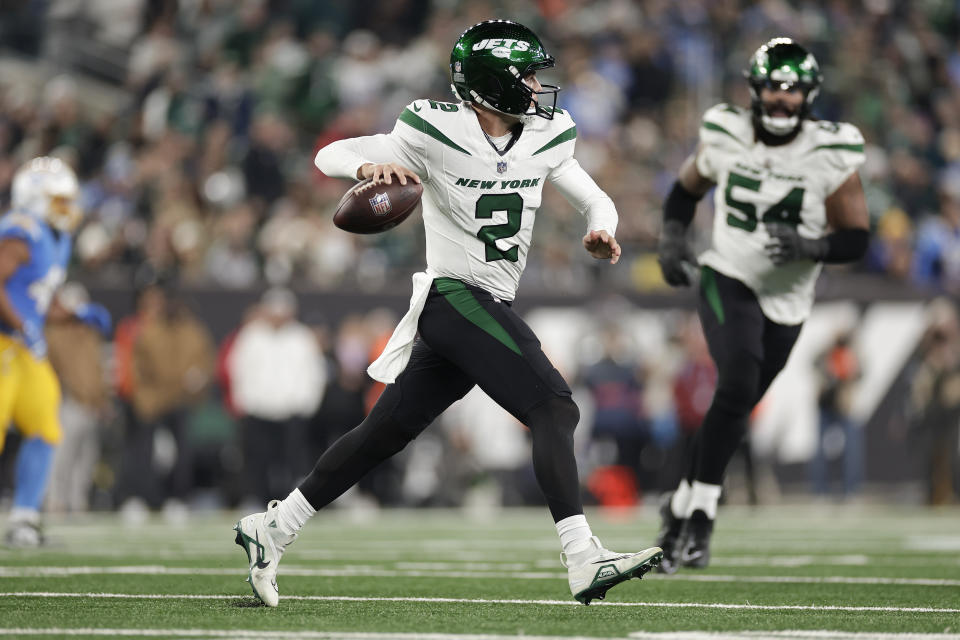 New York Jets quarterback Zach Wilson (2) rolls out of the pocket against the Los Angeles Chargers during the third quarter of an NFL football game, Monday, Nov. 6, 2023, in East Rutherford, N.J. (AP Photo/Adam Hunger)