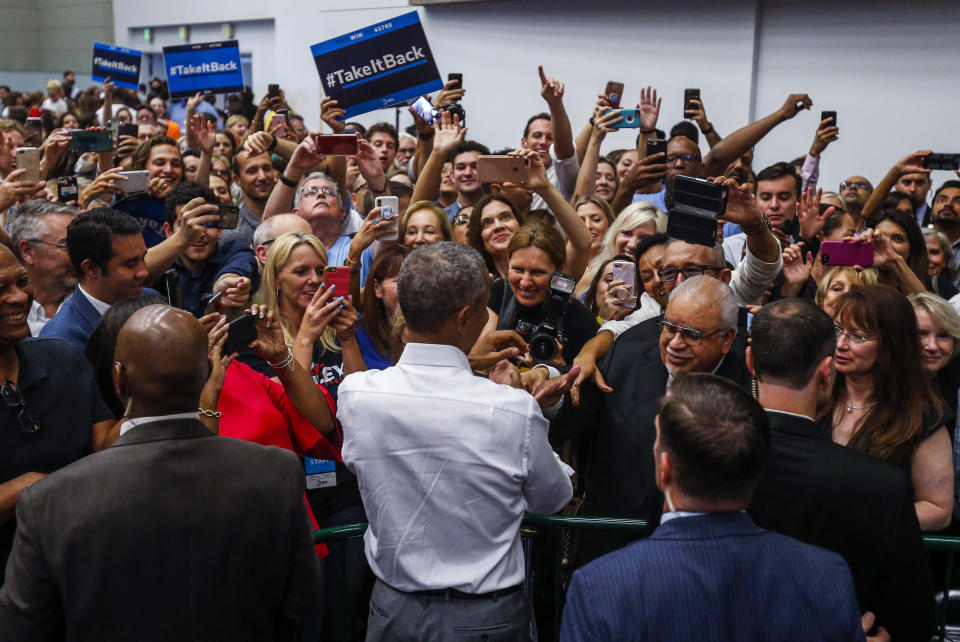 Former President Barack Obama greets supporters as he campaigns in support of California congressional candidates, Saturday, Sept. 8, 2018, in Anaheim, Calif. (AP Photo/Ringo H.W. Chiu)