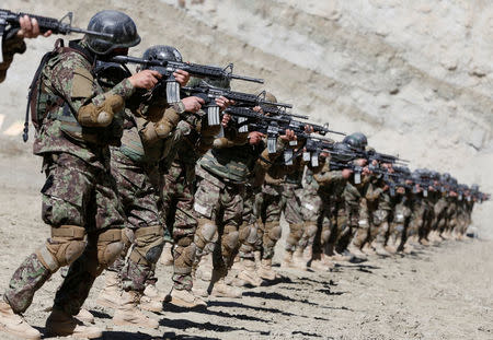 New recruits to the Afghan army Special Forces take part in a military exercise in Rishkhur district outside Kabul, Afghanistan February 25, 2017. Picture taken on February 25, 2017. REUTERS/Omar Sobhani