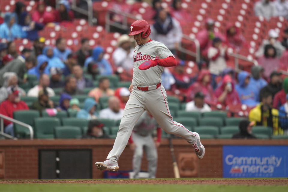 Philadelphia Phillies' J.T. Realmuto scores during the sixth inning of a baseball game against the St. Louis Cardinals Wednesday, April 10, 2024, in St. Louis. (AP Photo/Jeff Roberson)