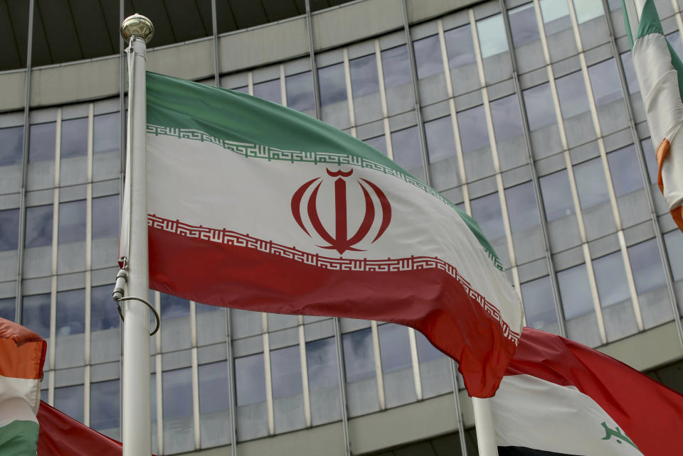 The Iranian flag waves outside of the UN building that hosts the International Atomic Energy Agency, IAEA, office inside in Vienna, Austria, Wednesday, July 10, 2019. President Donald Trump’s “maximum pressure” campaign against Iran is at a crossroads. His administration is trying to decide whether to risk stoking international tensions even more by ending one of the last remaining components of the 2015 nuclear deal. (AP Photo/Ronald Zak)