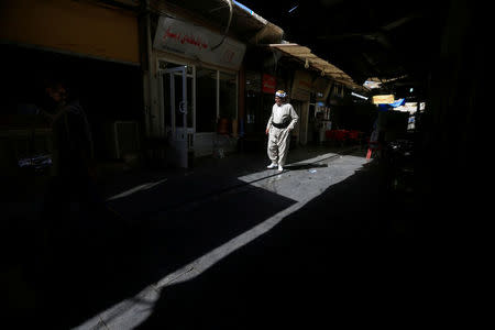 A Kurdish man walks in a neighborhood of the old city of Erbil, Iraq September 23, 2017. REUTERS/Alaa Al-Marjani