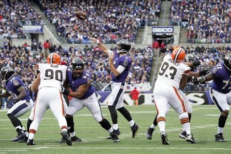 Dec 28, 2014; Baltimore, MD, USA; Baltimore Ravens quarterback Joe Flacco (5) throws during the first quarter against the Cleveland Browns at M&T Bank Stadium. Mandatory Credit: Tommy Gilligan-USA TODAY Sports