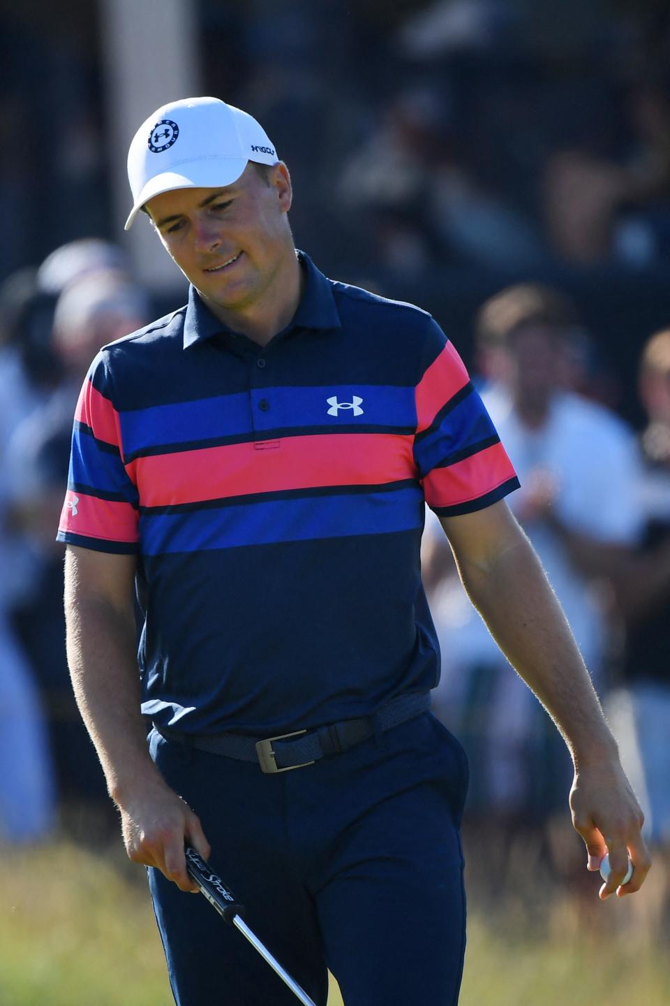 Jordan Spieth (pictured) reacts after a put on the 16th green during his final round on day 4 of The 149th British Open Golf Championship at Royal St George's.