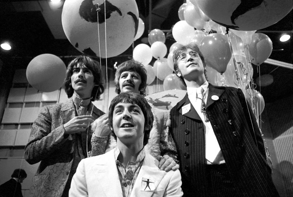 Photo of BEATLES, George Harrison, Paul McCartney, Ringo Starr, John Lennon posed, group shot at press conference before performing All You Need Is Love.