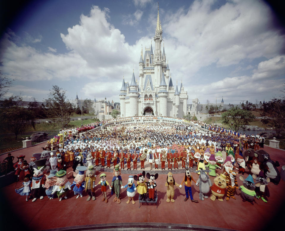 The Disney World staff poses for a photo to celebrate the park's opening.