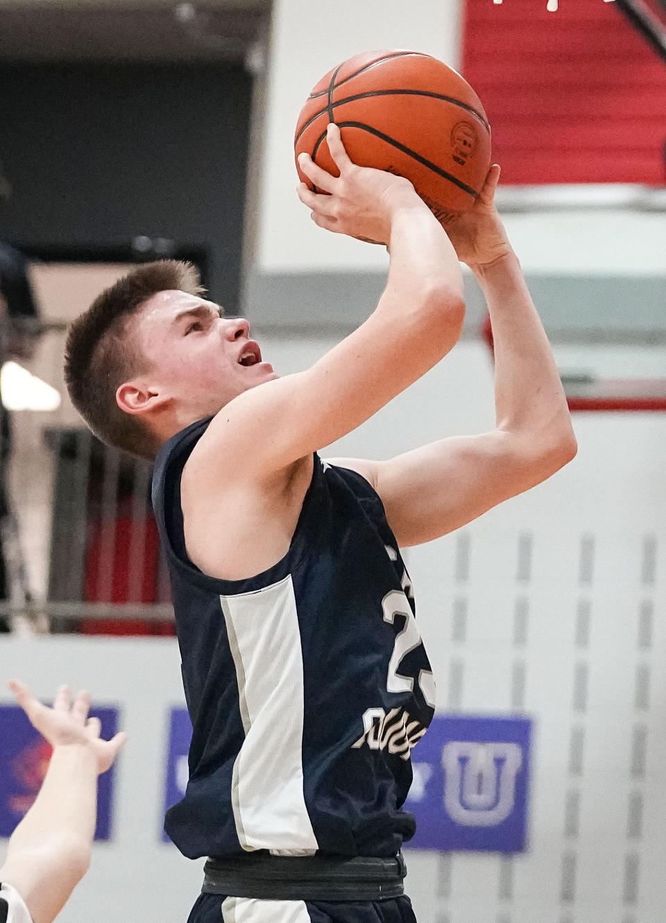 Greenwood Christian Academy Cougars Max Booher (23) reaches for a lay-up Thursday, Feb. 9, 2023 at Bethesda Christian High School in Brownsburg. The Greenwood Christian Academy Cougars defeated the Bethesda Christian Patriots, 66-43. 