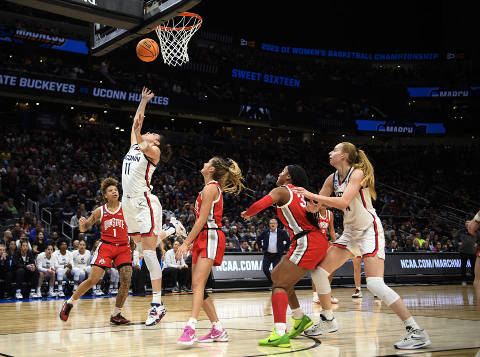 UConn forward Lou Lopez Senechal (11) scores a layup against Ohio State in the third quarter of a Sweet 16 college basketball game of the NCAA Tournament in Seattle, Saturday, March 25, 2023. (AP Photo/Caean Couto)