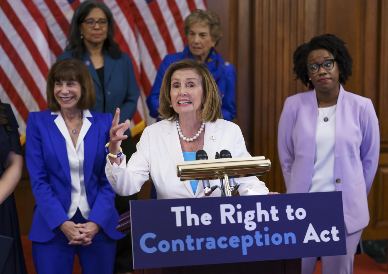 Speaker of the House Nancy Pelosi makes a point during an event with Democratic women House members and advocates for reproductive freedom ahead of the vote on the Right to Contraception Act, at the Capitol in Washington, Wednesday, July 20, 2022. She is flanked by Rep. Kathy Manning and Rep. Lauren Underwood. (J. Scott Applewhite/AP)