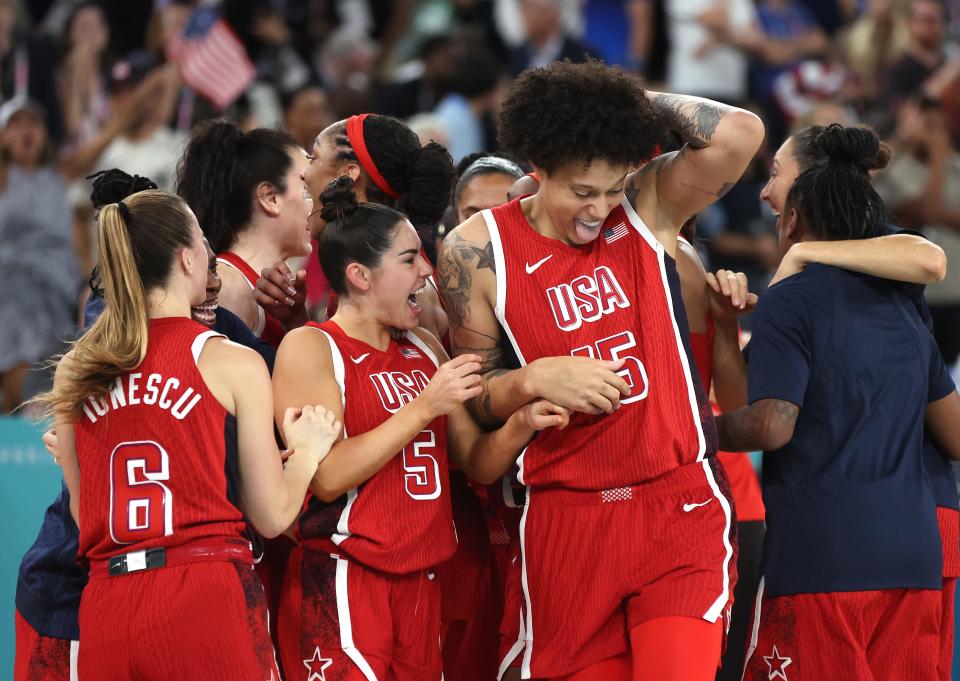 PARIS, FRANCE - AUGUST 11: Kelsey Plum #5 and Brittney Griner #15 of Team United States celebrate after their victory against Team France during the Women's Gold Medal game between Team France and Team United States on day sixteen of the Olympic Games Paris 2024 at Bercy Arena on August 11, 2024 in Paris, France. (Photo by Matthew Stockman/Getty Images) ORG XMIT: 776138675 ORIG FILE ID: 2166337666