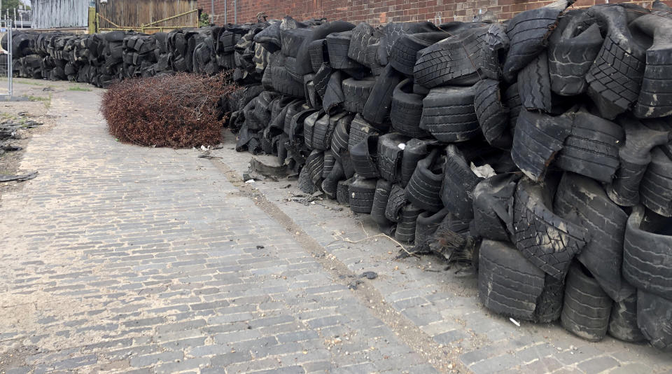A mountain of illegally dumped tyres is set to close a coastal footpath for a year. (SWNS)