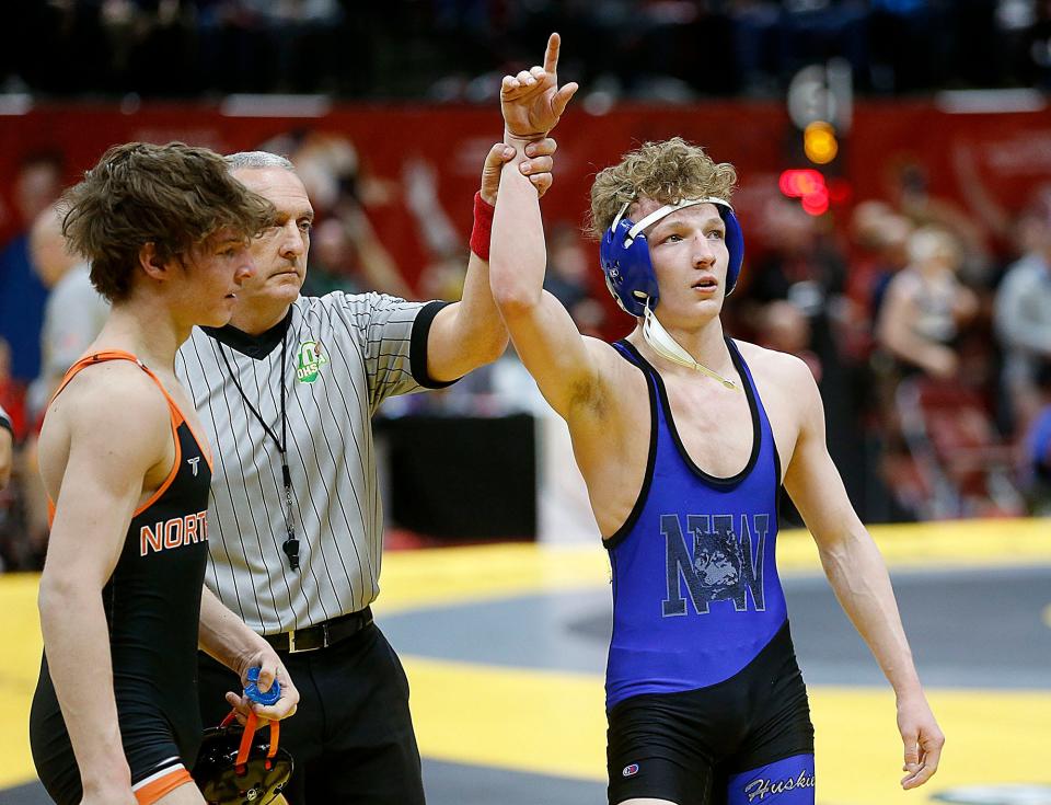 Northwestern's Trent Sigler has his hand raised after defeating North Union's Trace Williams during their 120 lbs. match at the OHSAA State Wrestling Championships Sunday, March 12, 2023 at the Jerome Schottenstein Center. . TOM E. PUSKAR/ASHLAND TIMES-GAZETTE