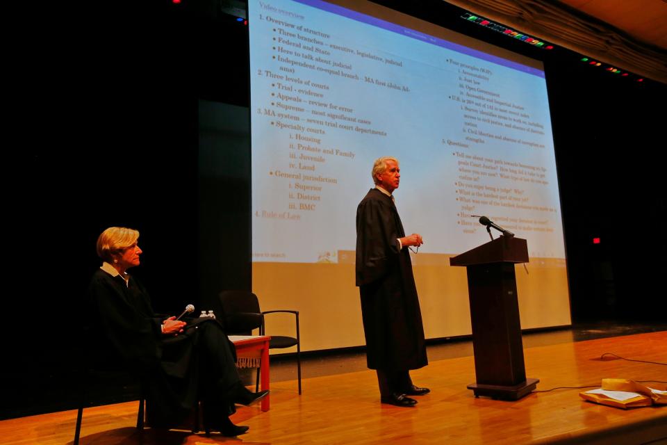 Chief Justice Mark Green and his wife, retired Associate Justice Karen Green, speak with Keith Middle School students on how the judicial system works, as part of Judicial Outreach Month.