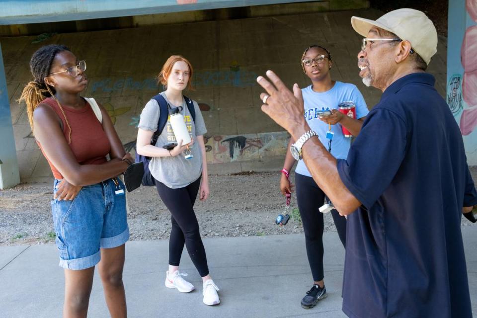 220615-Atlanta-Georgia Tech students Zarya Ajasin, from left, and Meg Sanders and Spelman student Sommer Madison listen to Darryl Haddock, director of environmental education for the West Atlanta Watershed Alliance as they mapped temperatures along the Westside Beltline on Wednesday, June 15, 2022, for a research study. Ben Gray for the Atlanta Journal-Constitution