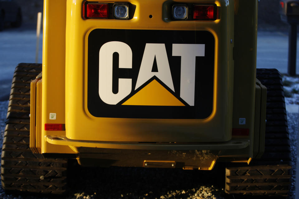 The CAT logo is seen on the back of a Caterpillar machine on a lot at Milton CAT in North Reading, Massachusetts January 23, 2013. Caterpillar, the world's largest maker of  tractors and excavators, took a $580 million charge last week as a result of  "accounting misconduct" at a unit of a Chinese mining equipment company it  bought last year. REUTERS/Jessica Rinaldi (UNITED STATES - Tags: BUSINESS CONSTRUCTION LOGO)