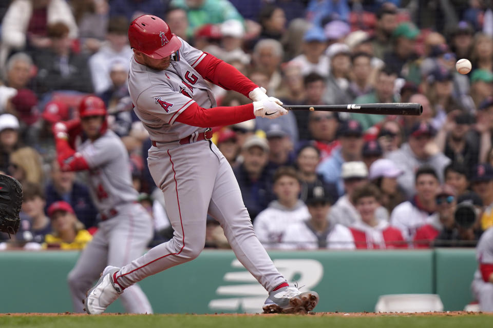 Los Angeles Angels' Brandon Drury singles, allowing Anthony Rendon to score, in the second inning of a baseball game against the Boston Red Sox, Sunday, April 16, 2023, in Boston. (AP Photo/Steven Senne)