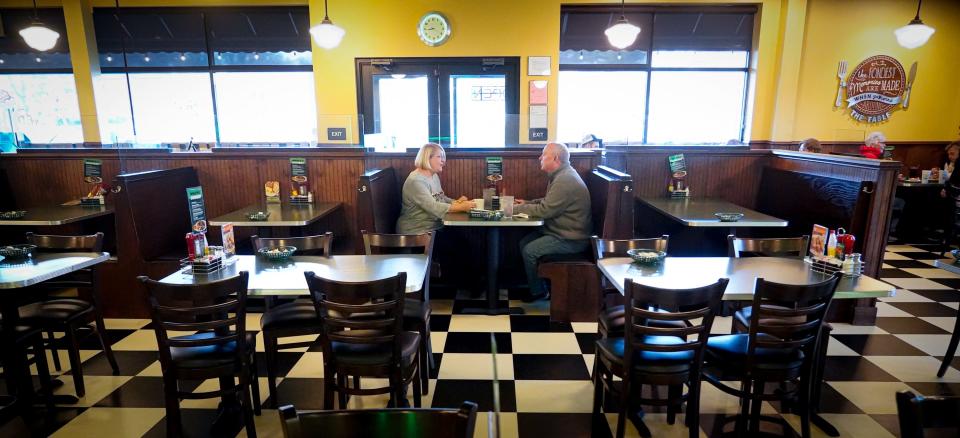 Carol and David Ringham, celebrate their one year anniversary with breakfast at the Metro Diner in the booth where they were married in 2023, on Wednesday, Jan.3, 2024 in Indianapolis.