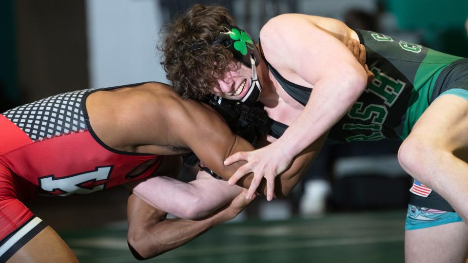 Camden Catholic's Austin Craft, right, battles Kingsway's Ben Dryden during a bout on Jan. 27. Craft delivered a 5-4 victory over St. Thomas Aquinas's Landon Kearns to highlight the Irish's win, which sent the squad to Sunday's state final.