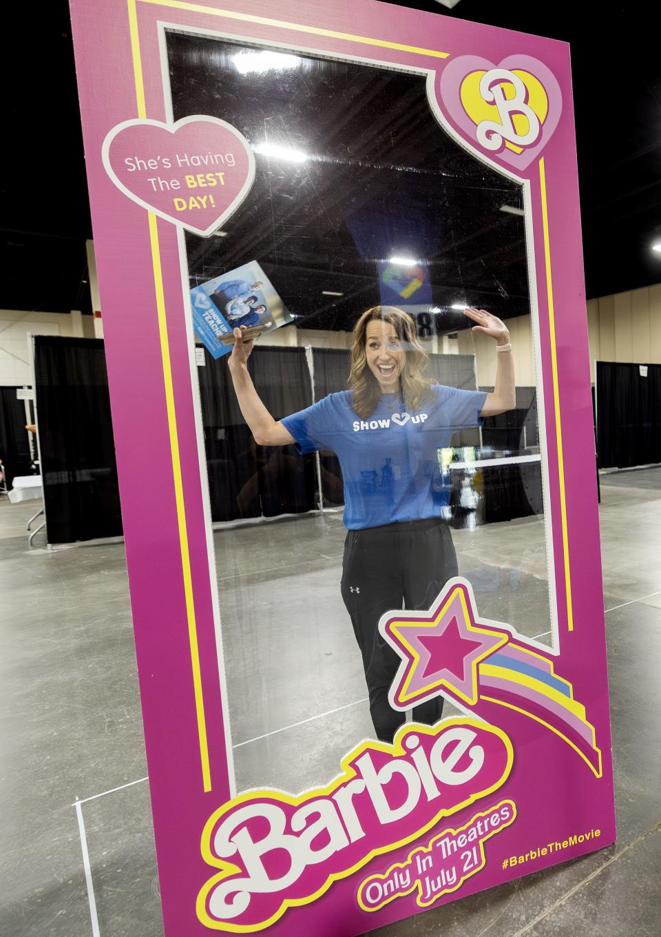 Utah first lady Abby Cox poses inside a Barbie frame as she and members of her team work to get ready for the Show Up for Teachers event at the Mountain America Exhibition Center in Sandy on Tuesday, July 18, 2023. | Scott G Winterton, Deseret News