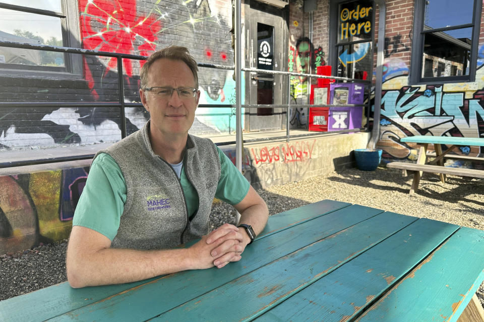 Dr. Benjamin Gilmer, the longtime advocate of Virginia inmate Vince Gilmer (no relation) who is expected to be released from prison later this week, poses outside an Asheville, N.C., restaurant on April 29, 2024. (AP Photo/Sarah Rankin)