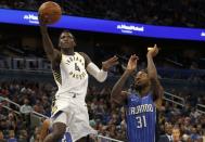 Nov 20, 2017; Orlando, FL, USA; Indiana Pacers guard Victor Oladipo (4) shoots a layup as Orlando Magic guard Terrence Ross (31) defends during the second quarter at Amway Center. Kim Klement-USA TODAY Sports